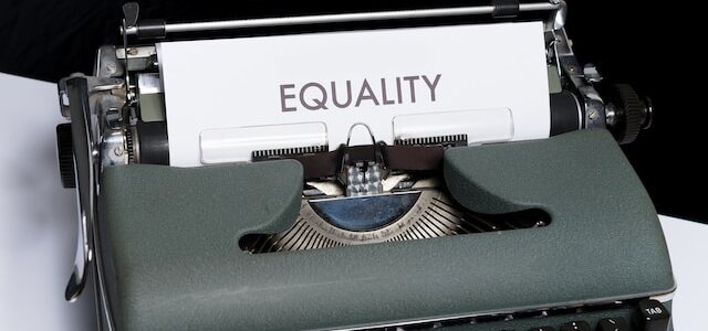 typewriter with equality on paper