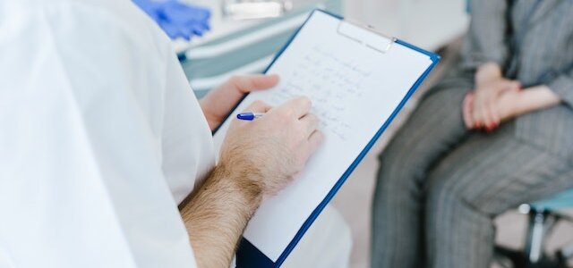 doctor writing note|